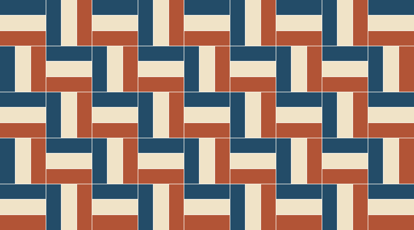 Rail Fence pattern of three-bar blocks in navy blue, cream and rust, alternating horizontal and vertical bars across the frame